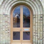 Arched timber door in stunning building