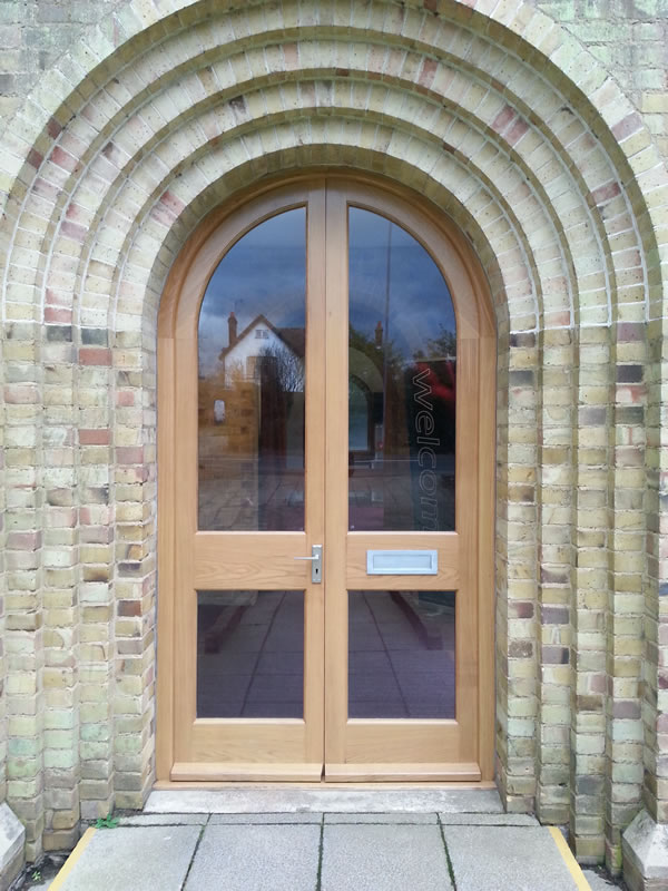 Arched timber door in stunning building