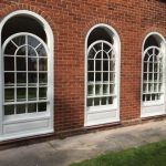 Three timber sliding sash windows curved