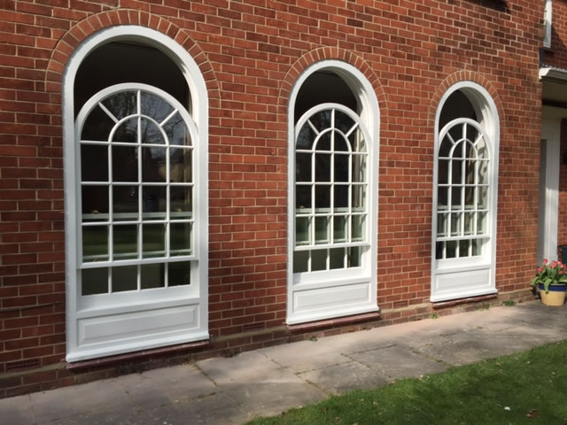 Three timber sliding sash windows curved