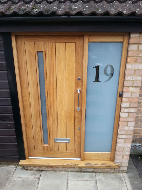 Timber entrance door with sidelight and frosted glass