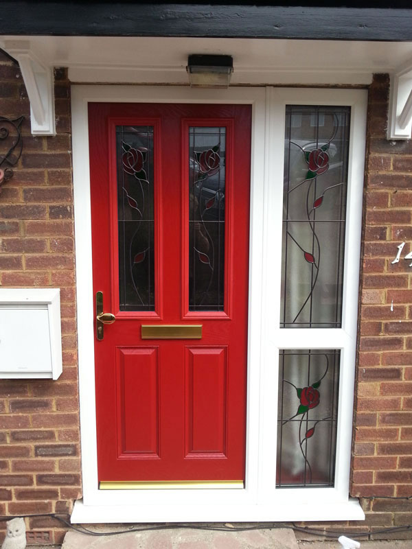 Red entrance door with decorative glass