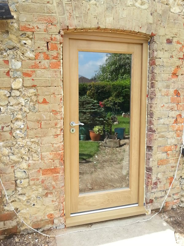 A timber external door with glazed pane