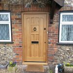 Oak front door with traditional hardware