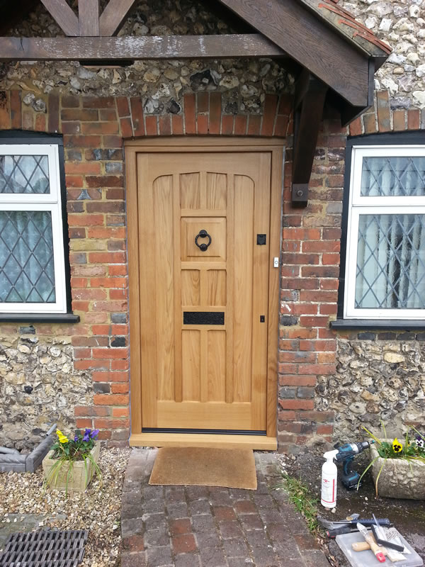 Oak front door with traditional hardware