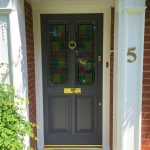 Painted timber front door with stained glass panels