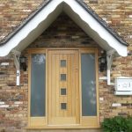 Timber front door with sidelights and glazed sections