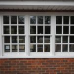 Three sliding sash windows in painted timber