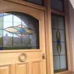 Entrance door in timber with custom stained glass design