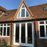 Timber angled windows painted white