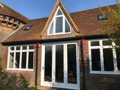 Timber angled windows painted white