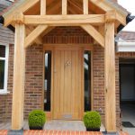 Timber front door with timber beams surrounding