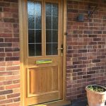 Timber door with lead detail installed