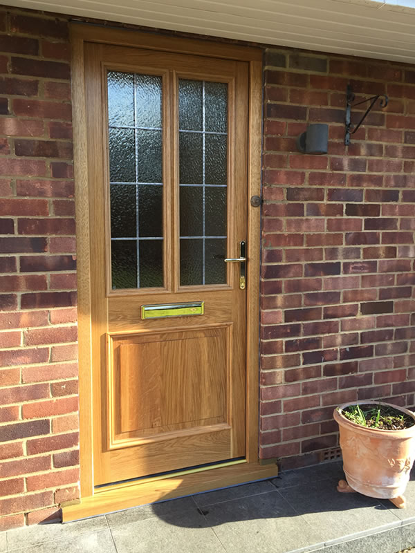 Timber door with lead detail installed