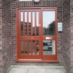 Timber front door with grate style