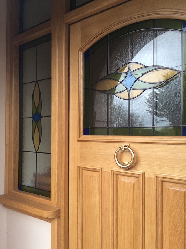 Oak door with custom stained glass