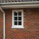 Small wooden sash window painted white