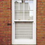 Timber sliding sash window in white