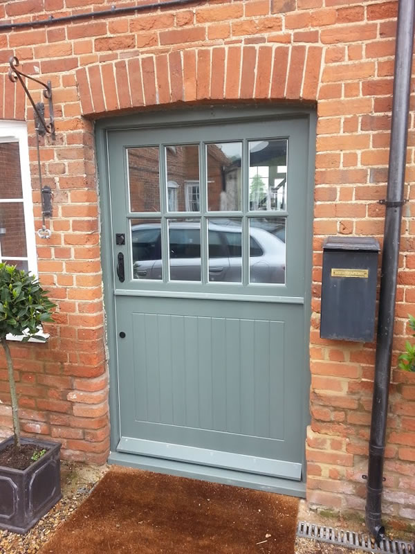Timber stable door in traditional green