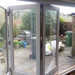 White bifold door in timber