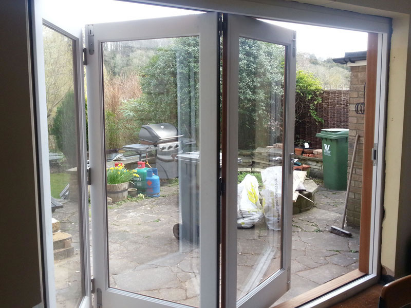 White bifold door in timber