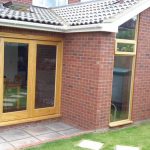 Timber bifolding doors leading onto the patio area